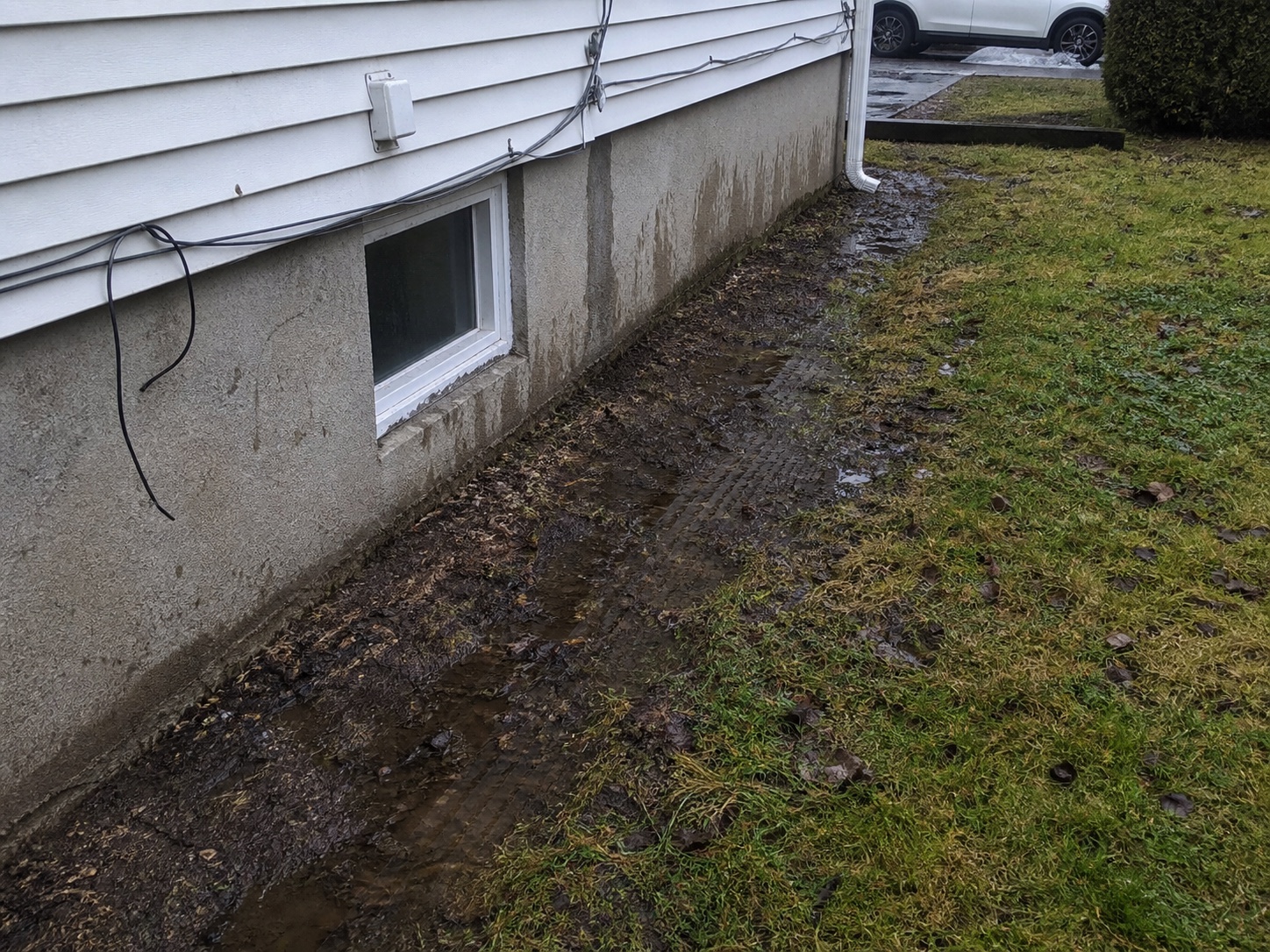 Failing foundation and French drain before the work